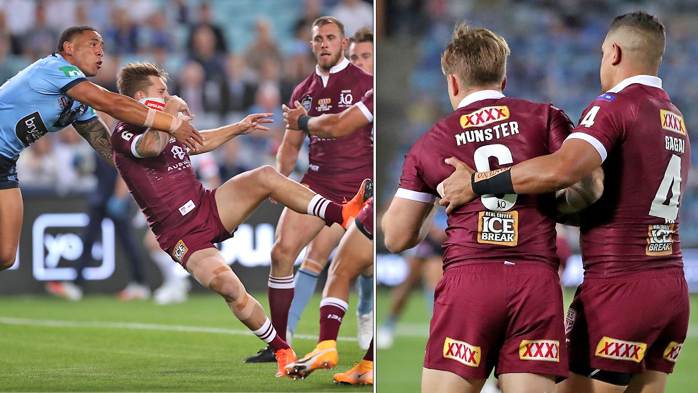 Cameron Munster of the Maroons and Tyson Frizell of the Blues compete for the ball 