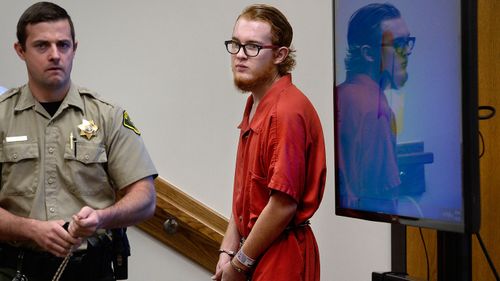 Defendant Tyerell Joe Przybycien, 18, of Spanish Fork, returns to court following a break that was taken after the video showing the hanging death was shown during his preliminary hearing (Scott Sommerdorf/The Salt Lake Tribune via AP).
