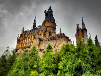 Rain drops and the reflection of Hogwarts School of Witchcraft and Wizardry in a lake at Universal Studios Japan.