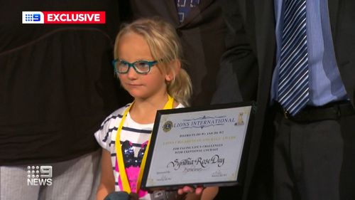 Synthia Braddock, five, was honored with a Children of Courage award for looking after her two younger brothers for 55 hours after a Christmas Day crash killed their parents.