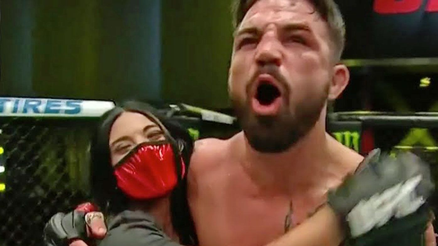 Mike Perry embraces his girlfriend after a win in the UFC