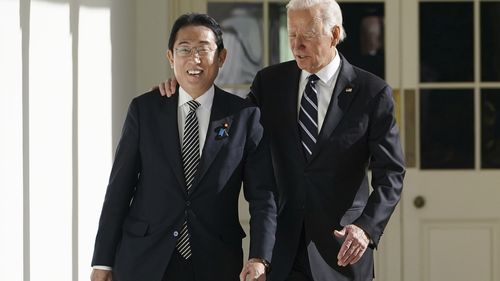 President Joe Biden and Japanese Prime Minister Fumio Kishida walk along the Colonnade of the White House, Friday, Jan. 13, 2023, in Washington.