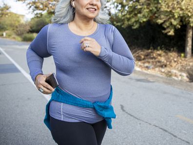 Stock image of a woman out on a run
