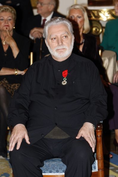 Fashion designer Paco Rabanne sits after being awarded the Legion of Honor by French Culture Minister Frederic Mitterrand in on April 16, 2010 Paris.