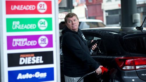 A Sydney motorist fills up his vehicle in Chippendale, in Sydney's inner west.