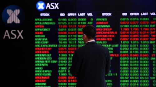 Australian stocks were down across the board at midday after days of record highs amid profit warnings and concerns about the deadly virus outbreak in China.