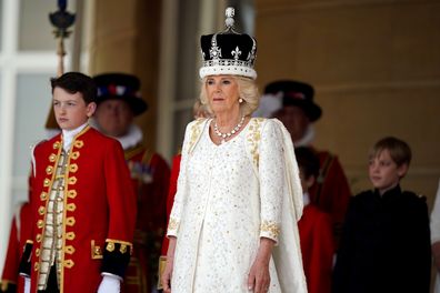 Queen Camilla receives a royal salute from members of the military in the gardens of Buckingham Place, London, following the coronation. May 6, 2023.