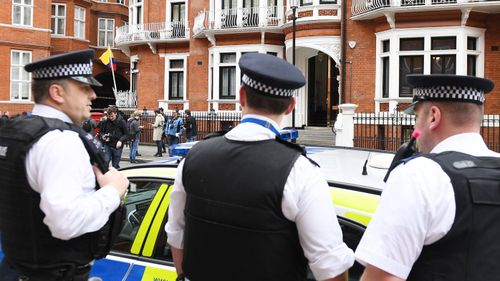 Police guard the Ecuadorian Embassy in London after news Swedish prosecutors have dropped allegations against WikiLeaks founder Julian Assange. (AAP)