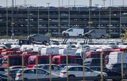 a card yard with hundreds of vans and suvs