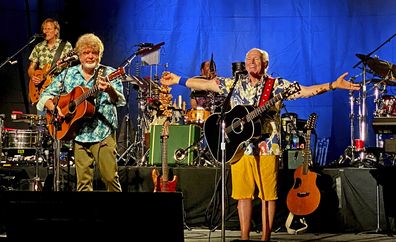 Singer-songwriter Jimmy Buffett, right, along with members of his Coral Reefer Band including Mac McAnally, center, perform during a concert in Key West, Florida  on Thursday, Feb. 9, 2023