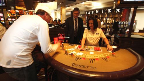 Robin Hood plays at a table in Las Vegas, Nevada. Cipriani, a pro gambler, set up a website and asked people to send in their hard luck stories and stating asked how much money would be needed to turn their lives.