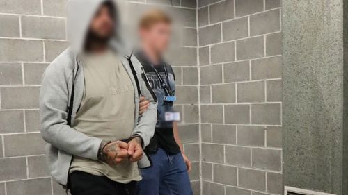 A﻿ member of a notorious dog breeding group has been charged with assault over an alleged altercation at a Sydney terrier show. 