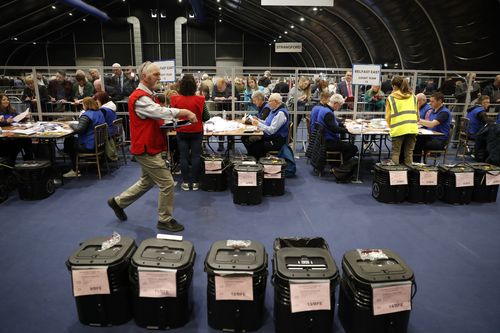 Election staff begin vote counting in Belfast in the Northern Ireland Assembly election early Friday in Belfast, Northern Ireland, Friday, May 6, 2022.