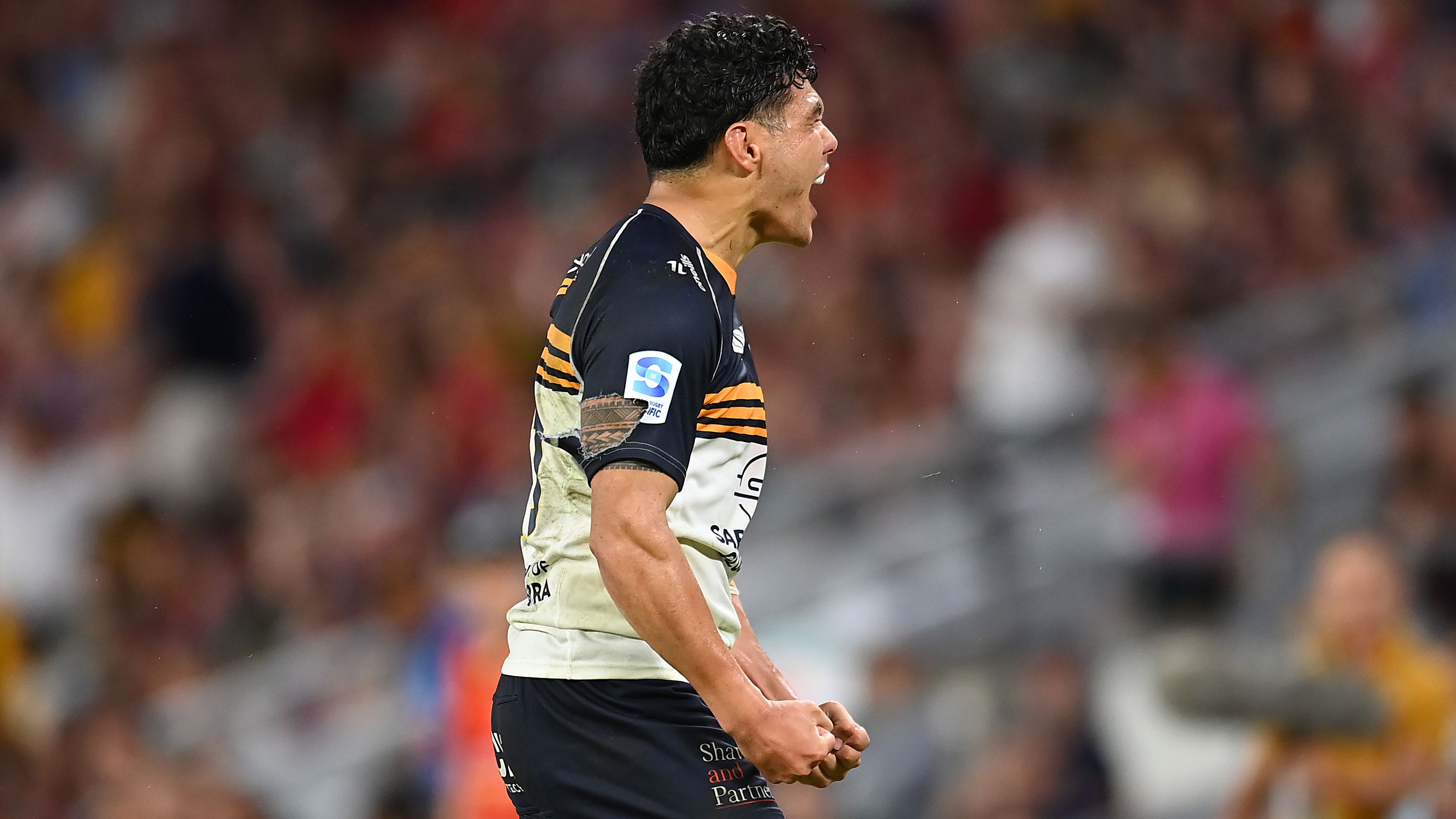 Noah Lolesio of the Brumbies celebrates the victory.