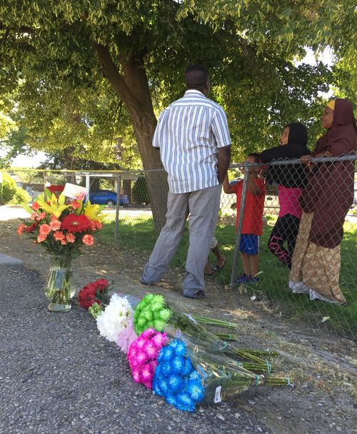 Floral tributes have been laid out front of the apartment complex where the children were attacked. Picture: AP