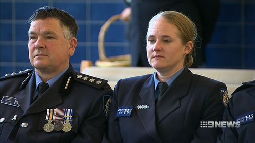 Police and SES volunteers stood alongside Ian's family and friends to say goodbye. Picture: 9NEWS