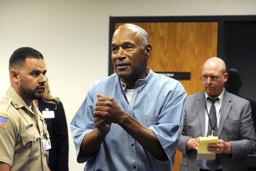 The former NFL football star O.J. Simpson reacts after learning he was granted parole during a hearing at the Lovelock Correctional Center in July. (AP)