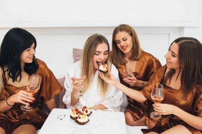 Bride and bridesmaids eating