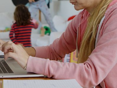 Woman using computer at home