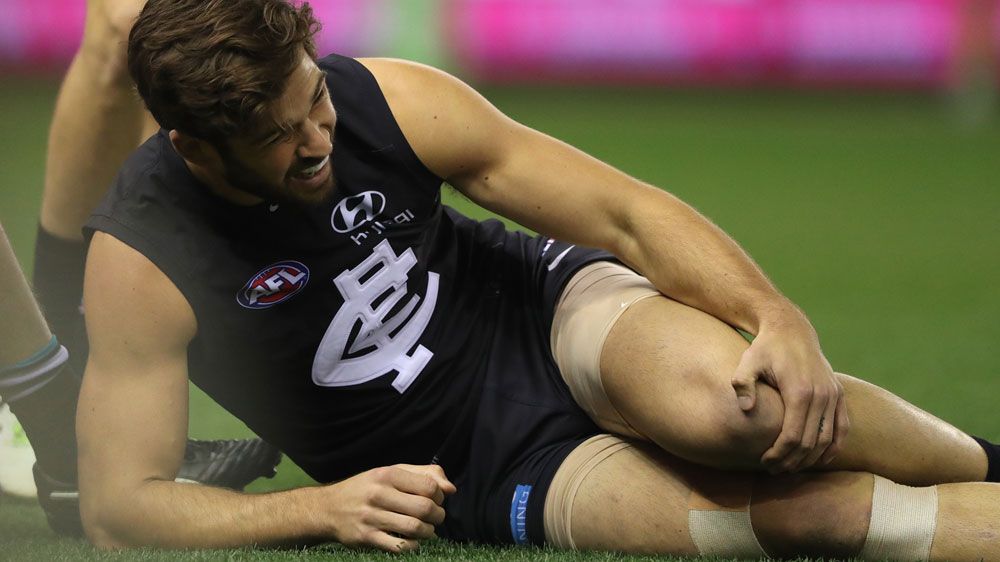 Levi Casboult grimaces in pain after injuring his knee. (Getty)