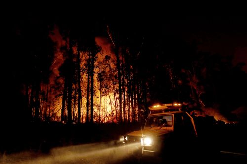 MALLACOOTA, AUSTRALIA - JANUARY 02: DELWP ( The Department of Environment, Land, Water and Planning ) and CFA ( Country Fire Authority ) Crews monitor fires and begin back burns between the towns of Orbost and Lakes Entrance in east Gipplsland  on January 02, 2020 in Australia. The HMAS Choules docked outside of Mallacoota this morning to evacuate thousands of people stranded in the remote coastal town following fires across East Gippsland which have killed one person and destroyed dozens of pro