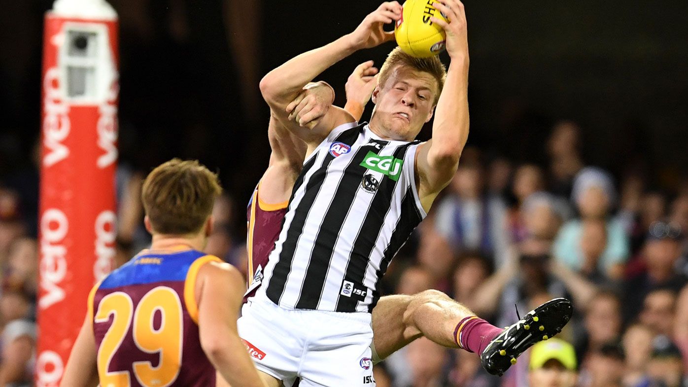Magpies sneak past Lions in AFL