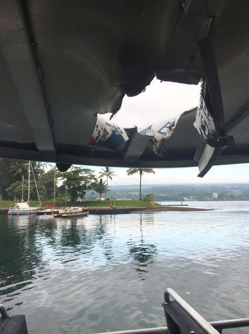 At least 13 people have been injured after an explosion sent lava flying through the roof of a tour boat off Hawaii's Big Island. Picture: AP