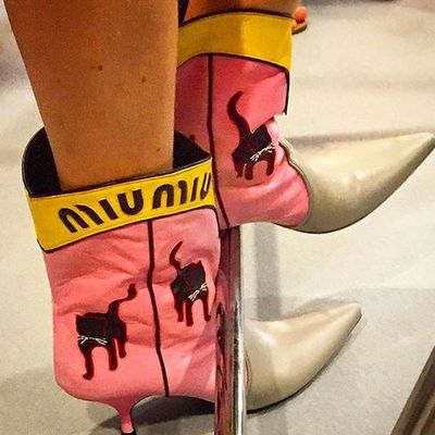 Kitties adorned boots that could have walked out of a John Wayne film and into Miuccia's workshop.