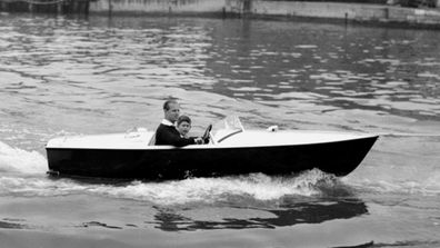 Prince Philip The Duke of Edinburgh takes Prince Charles on a motor boat ride up the River Medina at Cowes Regatta in 1957