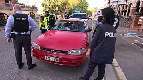 A full carload of unmasked people heading for protest action in the city this morning was captured by 9News being arrested after refusing several officers directives. 