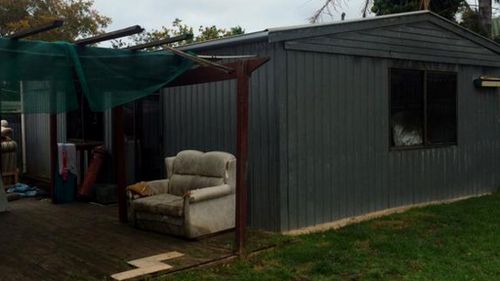 The free-standing garage, converted into a shed, was alight when the owners were woken up by Stan's barks. (9NEWS)