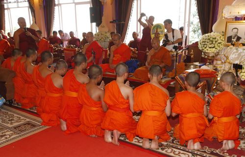 Dressed in robes with shaved heads, the boys have come out of monkhood, where they were being cared for. Picture: AAP