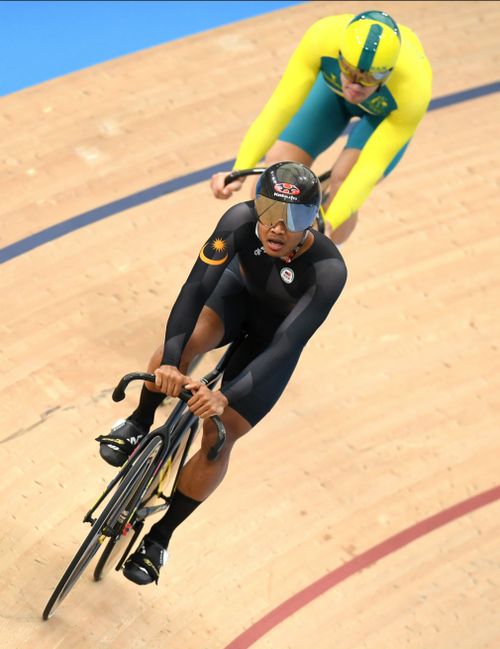 Sahrom of Malaysia in front of Glaetzer during the men's sprint qualifying event. (AAP)