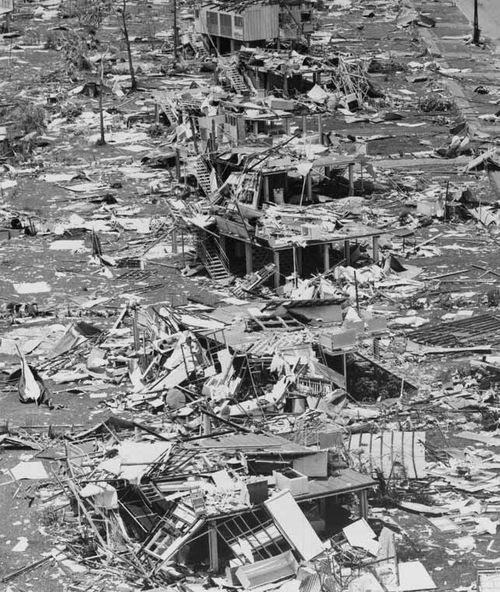 A photograph on June 26, 1975 of Darwin after Cyclone Tracy hit last Christmas day shows a row of stilt houses smashed and surrounded by rubble. 