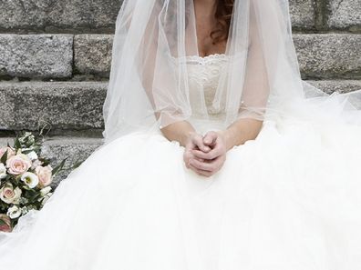 Bride sad sitting on steps