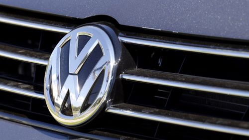 Police raid Volkswagen headquarters as US chief apologises