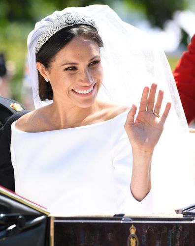Meghan Markle rides a horse-drawn carriage, after their wedding ceremony at St. George's Chapel in Windsor Castle in Windsor, near London, England, Saturday, May 19, 2018