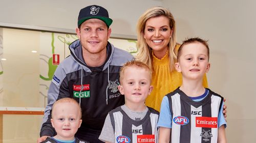 Harvey, 3, (L) with brothers Alfie and Charlie. The keen Collingwood trio met Bec Maddern and Collingwood FC's Taylor Adams. (Nine)