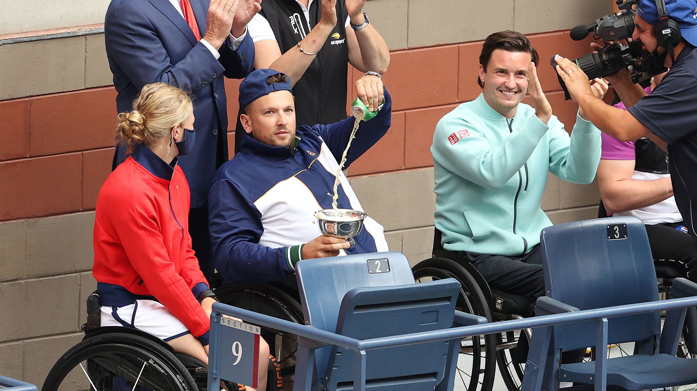 Dylan Alcott pours a beer into his trophy at the US Open last year. 