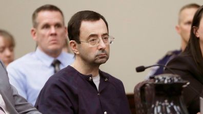 Former gymnast Rachael Denhollander is hugged after giving her victim impact statement. Picture: AP Larry Nassar sits during his sentencing hearing on January 24, 2018. Picture: AP