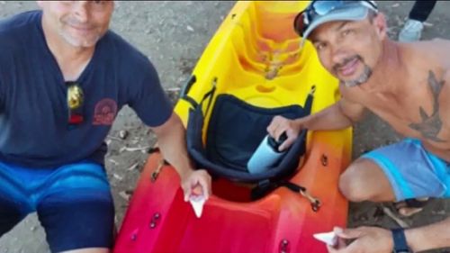 Two men returned to shore unscathed after a great white shark attacked their kayak leaving two giant teeth behind.