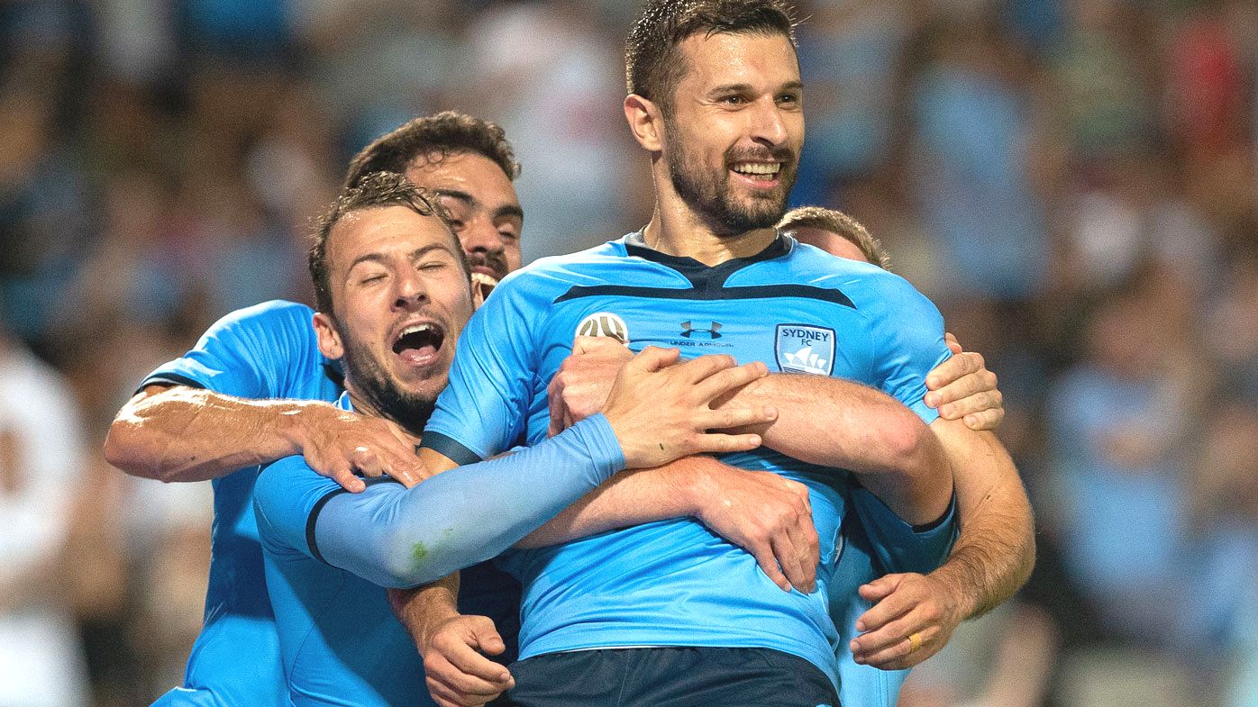 Kosta Barbarouses celebrated with Sydney FC teammates. (Getty)