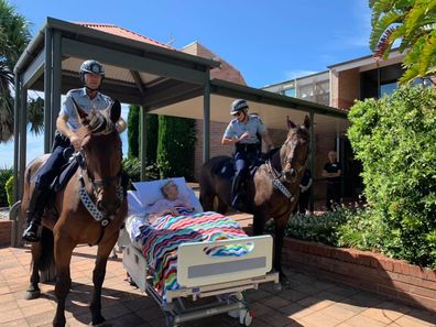 Mrs Meredith with members of the mounted unit of the NSW police.