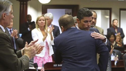 He is hugged and congratulated by House members. (AAP)