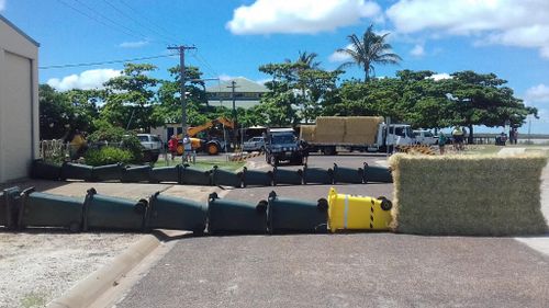 Locals worked to create a "wheelie bin blockade". (Queensland Police)