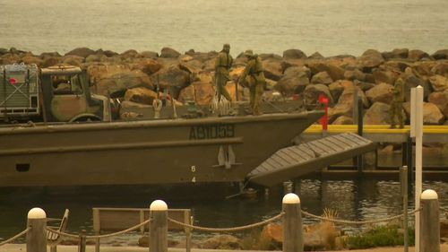 Military vehicles arrive in Mallacoota.