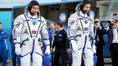 Russian Alexey Ovchinin and American Nick Hague stroll out to the launch of the Soyuz MS-10 spacecraft.