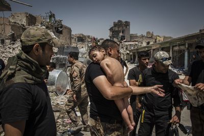 The Battle for Mosul - Young Boy Is Cared for by
Iraqi Special Forces Soldiers
