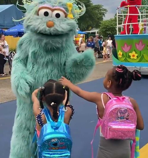 The Sesame Street character high-fived others in the parade but waved off two little Black girls.