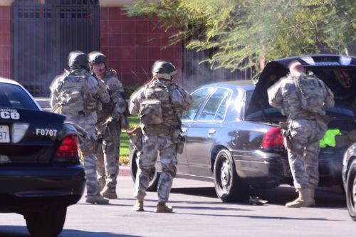 Heavily armed police at the scene. (Doug Saunders/AAP)